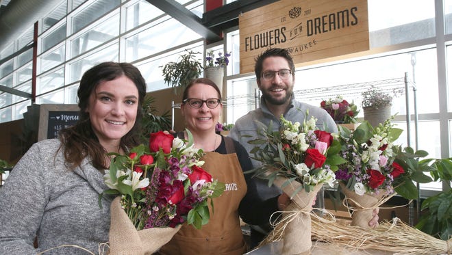Lindsay Leinenkugel (from left), Milwaukee marketing manager; Heidi Steeno, retail assistant; and Steven Dyme, co-founder and CEO of Flowers for Dreams; are operating a pop-up shop at the Milwaukee Public Market through Feb. 15.