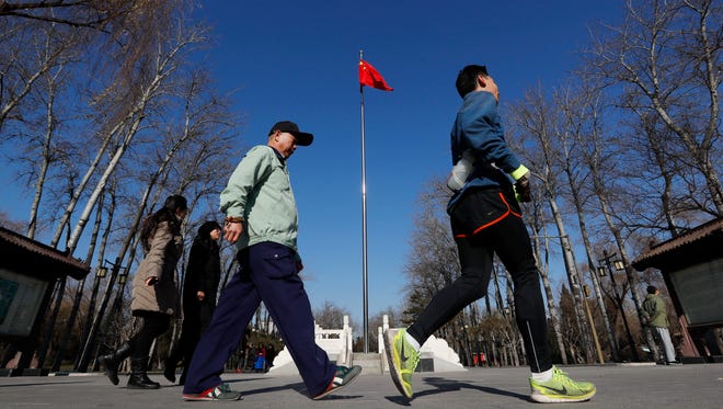 People exercise at Ritan Park in Beijing on Dec. 22, 2016.  The world's most populous nation has the second-largest economy, one of the highest savings rates and mushrooming wealth. Yet virtually no one has a will to pass on an estate.