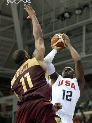 U.S. forward Damien Wilkins shoots against Venezuela center Luis Bethelmy during the 2015 Pan Am Games at Ryerson Athletic Centre in Toronto.