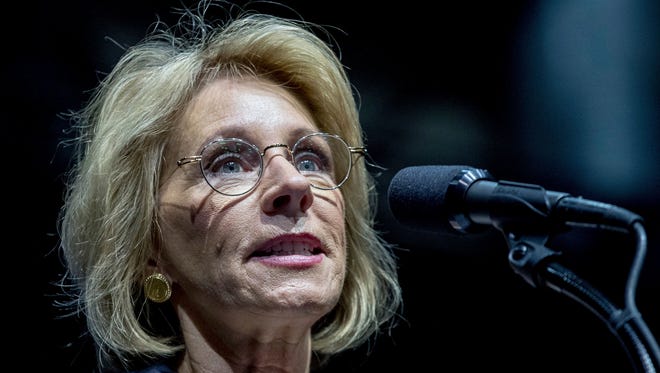President-elect Donald Trump's pick for education secretary, Betsy DeVos, speaks during a rally at DeltaPlex Arena, Friday, Dec. 9, 2016, in Grand Rapids, Mich.