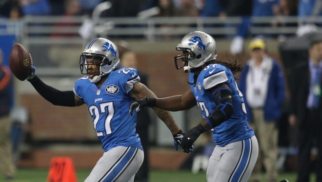Lions safety Glover Quin celebrates after intercepting Bears QB Jay Cutler during the second half on Thanksgiving.