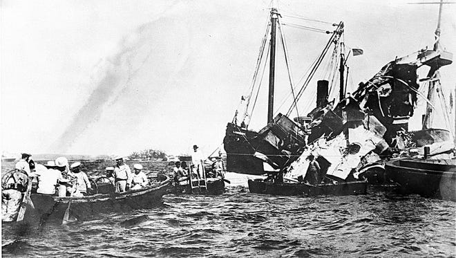 Lifeboats rescue surviving crewmen of the wrecked USS Maine after an underground explosion destroyed the battleship on the night of Feb. 15 as it was anchored in the Havana harbor, Cuba, in 1898. About 260 U.S. Naval personnel were killed in the explosion. The sinking of the U.S. warship was a catalyst for the outbreak of the Spanish-American War and the U.S. officially waged war on April 25. (AP Photo)