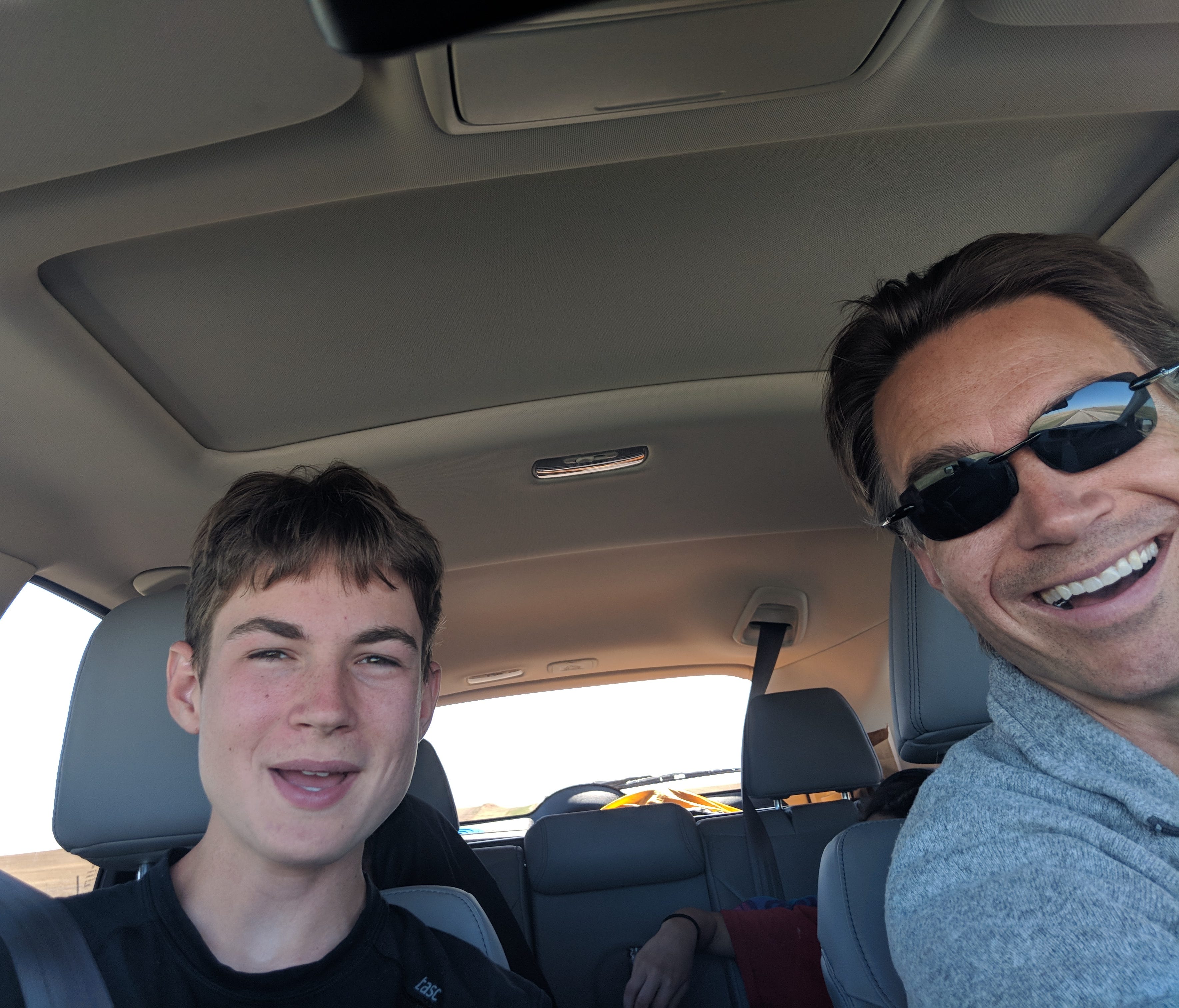 Aren Elliott (left) and the author get a little silly after two full days in the car. Note Aren's sister in the back, sleeping.