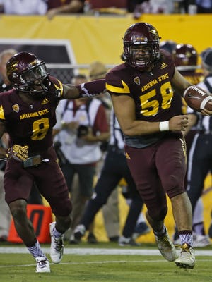 ASU's Salamo Fiso (58) celebrates after intercepting a pass against California during the second half at Sun Devil Stadium on September 24, 2016 in Tempe, Ariz.