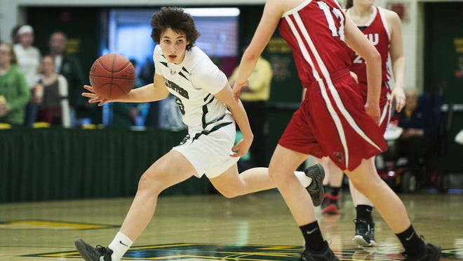 St. Johnsbury's Sadie Stetson (5) dribbles the ball during last year's Division I girls basketball championship between the Champlain Valley Union Redhawks and the St. Johnsbury Hilltoppers.