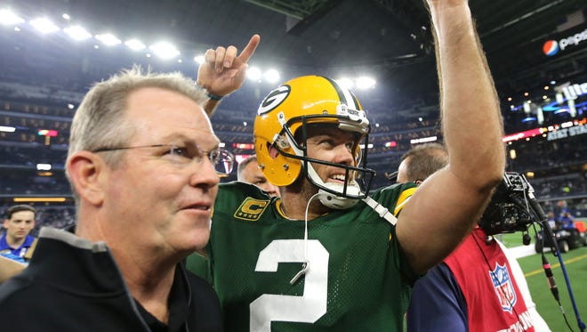 Green Bay Packers kicker Mason Crosby celebrates as he walks off the field after kicking the game-winning field goal to beat the Dallas Cowboys in the NFC divisional playoff at AT&T Stadium.