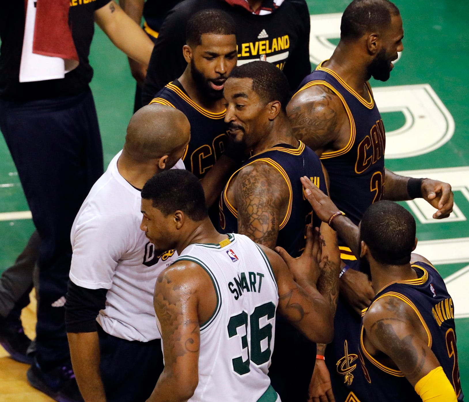 Cleveland Cavaliers guard JR Smith (5) reacts with his team after a play against the Boston Celtics during the second quarter in game two of the Eastern conference finals of the NBA Playoffs at TD Garden. Mandatory Credit: David Butler II-USA TODAY S