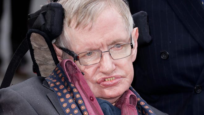 FILE - In this March 30, 2015 file photo, Professor Stephen Hawking arrives for the Interstellar Live show at the Royal Albert Hall in central London. Hawking, whose brilliant mind ranged across time and space though his body was paralyzed by disease, has died, a family spokesman said early Wednesday, March 14, 2018.