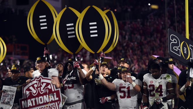 The Alabama Crimson Tide celebrate after beating the Clemson Tigers in the 2016 CFP National Championship at University of Phoenix Stadium.