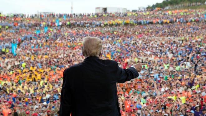 President Trump gestures to the crowd after speaking at the 2017 National Scout Jamboree in Glen Jean, W.Va., Monday.