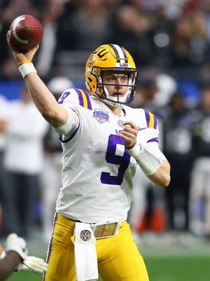 LSU quarterback Joe Burrow (9) throws a pass during the second half of a Fiesta Bowl NCAA college football game against UCF Tuesday, Jan. 1, 2019, in Glendale, Ariz. LSU defeated UCF 40-32. (AP Photo/Ross D. Franklin)