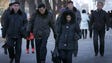 People walk down the street in Pyongyang, Feb. 12,