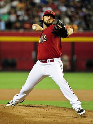 Diamondbacks starting pitcher Mike Bolsinger (49) throws during the first inning against the San Francisco Giants at Chase Field.