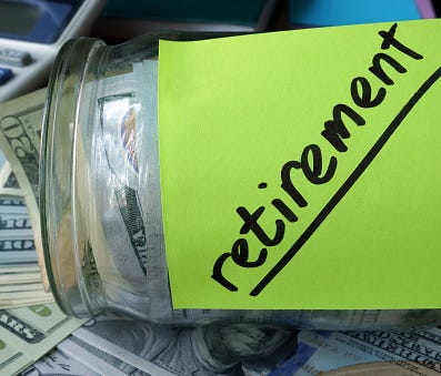 Jar with label Retirement Plan and money on the table.