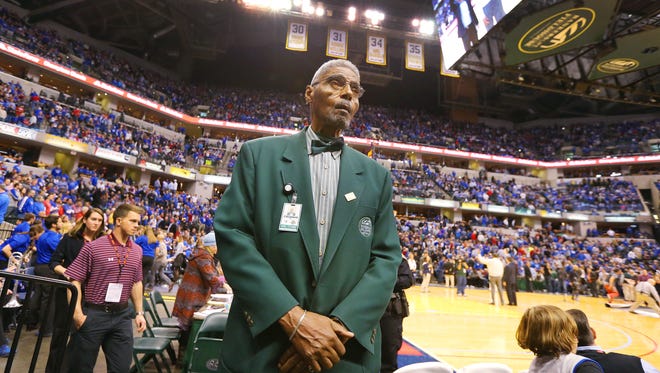 Former Crispus Attucks Tiger Cleveland Harp now works the stands as an usher at Bankers Life Fieldhouse. Here he works  a college doubleheader on Tuesday, November 18, 2014.