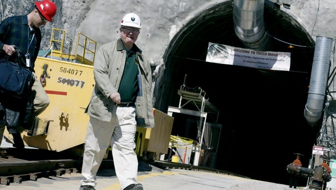U.S. Secretary of Energy Samuel Bodman, right, is shown during a 2006 tour of Yucca Mountain, the Department of Energy's dormant nuclear waste repository in Yucca Mountain, Nev.
