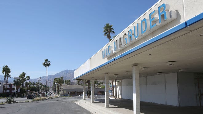 The shuttered Mac Magruder dealership on South Palm Canyon Drive. Palm Springs is asking a judge to force the owners to repair the building or tear it down.
