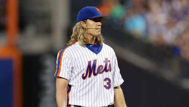 Noah Syndergaard reacts after he is ejected from the game in the third inning.