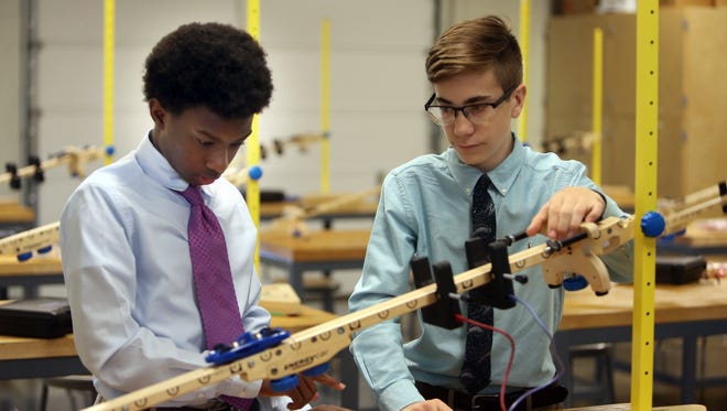 Christian Brothers High School sophomores Porter Askew, left, and William Trotter work in the engineering lab calculating the acceleration of an object on Sept. 21.