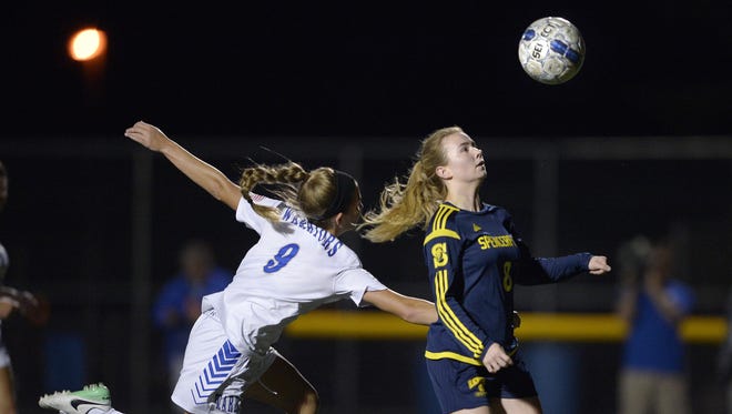 Spencerport’s Leah Wengender, right, looks to control the ball.