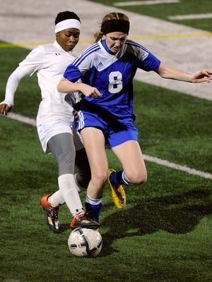 Abilene High's Finda Kollie (7) steals the ball away from Weatherford's Abbie Griffin (8) during the first half of the Lady Eagles' 5-0 win on Friday, Feb. 3, 2017, at Shotwell Stadium. Kollie scored three goals in the game. 