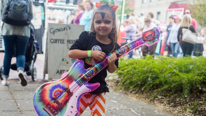 Ariana Johnson rocks out during the Gallatin Main Street Festival on Saturday, October 1.