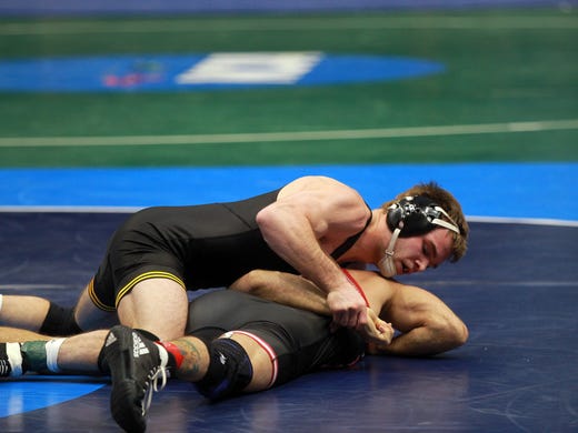Iowa's Brandon Sorensen wrestles Rutgers' Eleazar Deluca