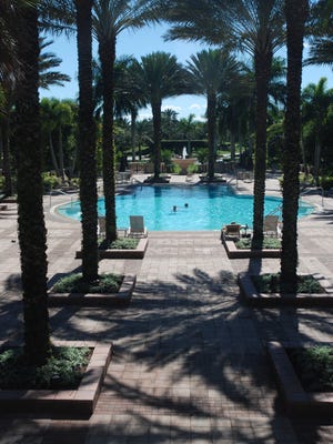 
Residents at West Bay Club enjoy many amenities including the resort style pool and clubhouse. 
