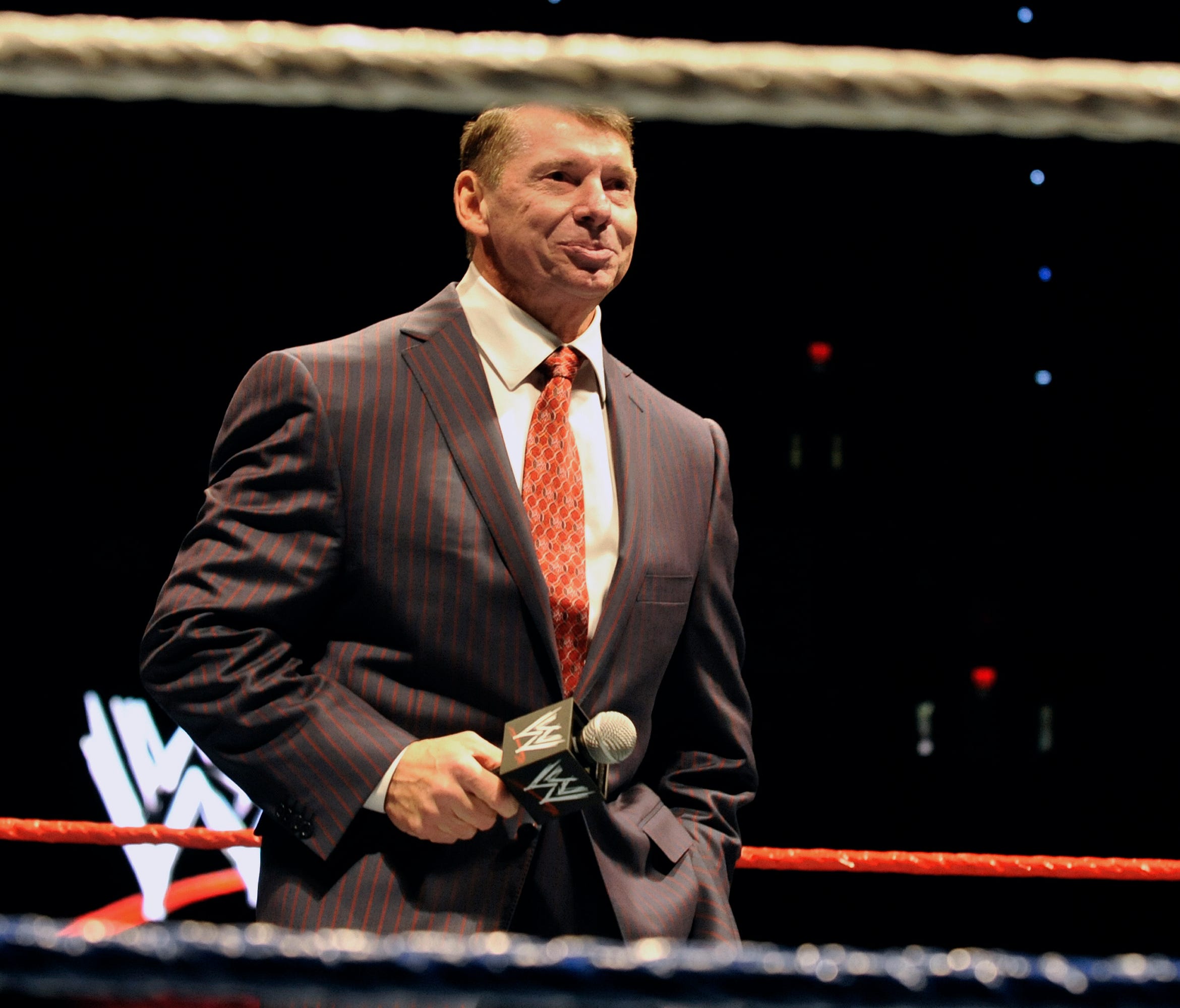FILE - In this Oct. 30, 2010 file photo, WWE chairman and CEO Vince McMahon speaks to an audience during a WWE fan appreciation event in Hartford, Conn.   WWE's 'Raw' set out to be a special kind of wrestling show from its birth on Jan. 11, 1993. 