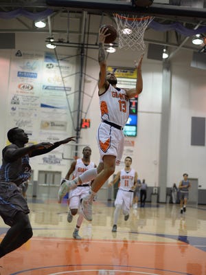 COS sophomore Guard Cody Wilson attacks the basketball against Cerro Coso on Wednesday at Porter Field House.