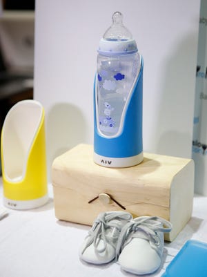 The Baby Glgl by Slow Control holds a baby bottle and can record how fast and how much a baby is drinking and it can send that information to a mobile device.
