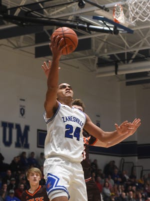 Zanesville's Aronde' Myers puts up a shot against Meadowbrook Friday night.