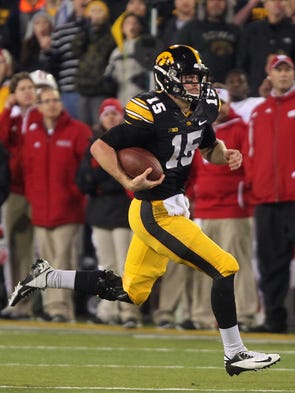 Iowa's Jake Rudock runs for 21 yards during the Hawkeyes'