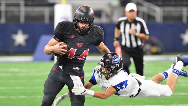 Strawn running back Tanner Hodgkins shakes off Balmorhea defensive back Josiah Garcia to score a touchdown in the Greyhounds 78-42 win over the Bears in the Class 1A Division II state title game Wednesday at AT&T Stadium in Arlington.