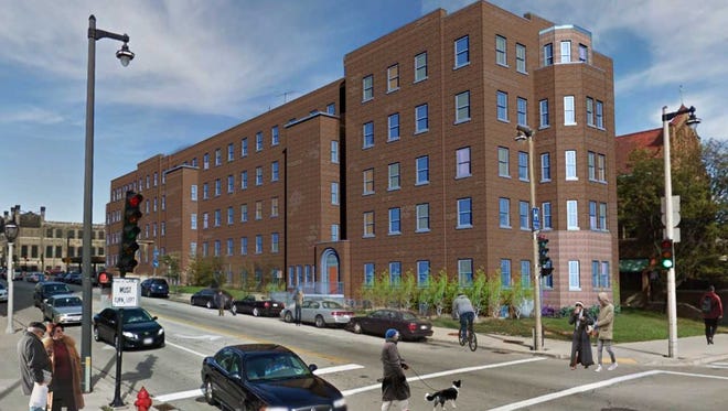A former hospital and community corrections center is being converted into a 60-unit apartment building for homeless people on downtown Milwaukee's west side.