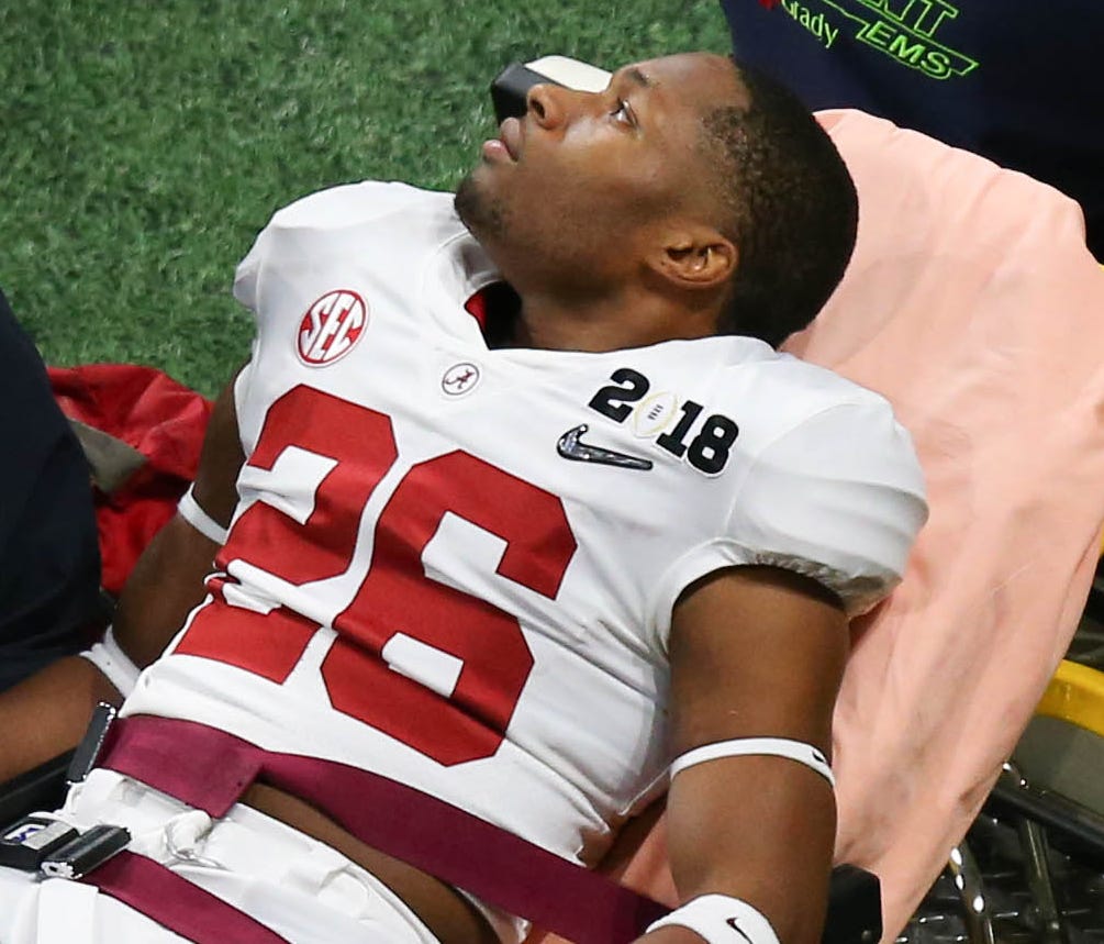 Crimson Tide defensive back Kyriq McDonald is carted off the field during the third quarter against the Georgia Bulldogs after collapsing on the sideline.