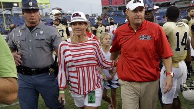 Mississippi head coach Hugh Freeze leaves the field after beating Vanderbilt in an NCAA college football game Saturday, Sept. 6, 2014, in Nashville, Tenn. Mississippi won 41-3. (AP Photo/Mark Humphrey)