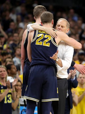 Michigan coach John Beilein greets Duncan Robinson as he leaves the floor in the final seconds of the 79-62 in the national championship game to Villanova on Monday, April 2, 2018, at the Alamodome in San Antonio.