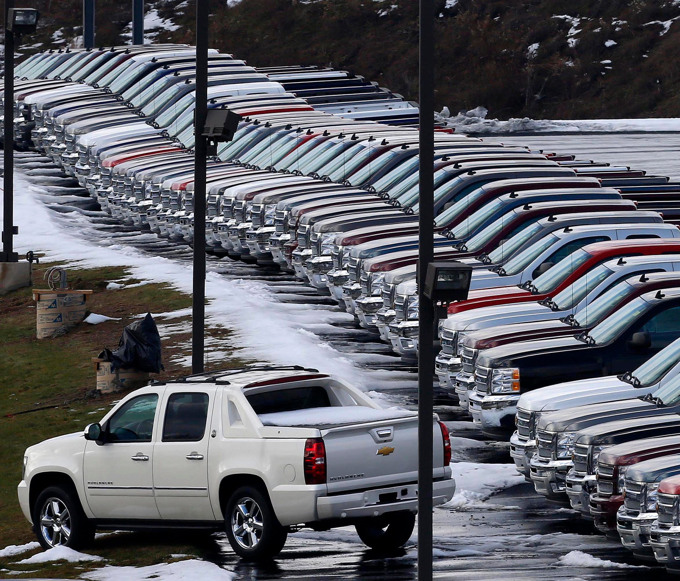 Chevy trucks line the lot of a dealer in Murrysville, Pa. , in this 2013 file photo