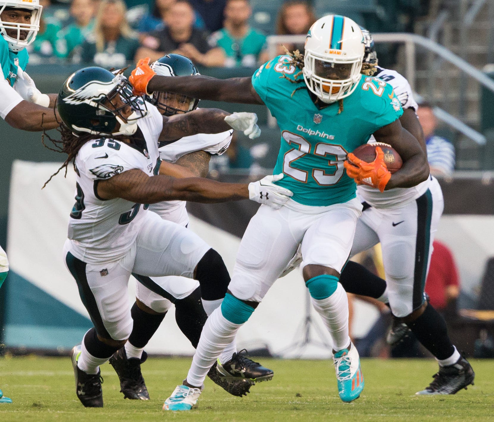 Miami Dolphins running back Jay Ajayi (23) breaks the tackle attempt of Philadelphia Eagles cornerback Ronald Darby (35) during the first quarter at Lincoln Financial Field.