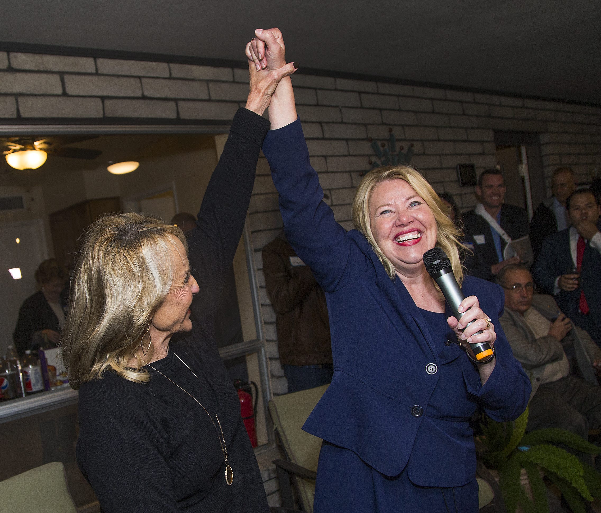 Former Gov. Jan Brewer, left, and Debbie Lesko, right, celebrate victory at a campaign gathering at home in Peoria on February 27, 2018. Lesko pulled out to an early lead in the special primary election.