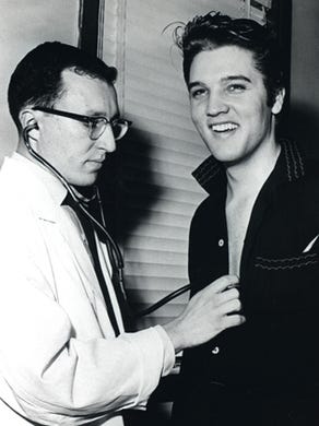Elvis Presley at Kennedy Veterans Hospital on Getwell Jan. 4, 1957. Elvis reported to the hospital that afternoon for his army pre-induction physical performed by Capt. Leonard Glick and a written qualification exam administered by Lt. Jack Zager just days before his 22nd birthday on Jan. 8. Elvis left for New York by train later that evening for his third and final appearance on Ed Sullivan's 'Toast of the Town Show,' which broadcast Jan. 6.