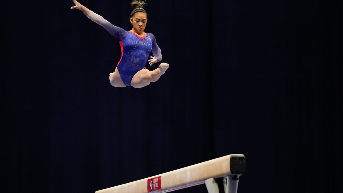 Suni Lee competes on the balance beam during the women's U.S. Olympic Gymnastics Trials Friday, June 25, 2021, in St. Louis. (AP Photo/Jeff Roberson)