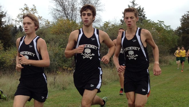 (From left)  Pinckney’s Chase Schweyer, Nick Hartstang and Aaron Jarema are part of a team that won a Division 1 regional at St. Johns on Friday. The Pirates qualified for next weekend's Division 1 state meet.