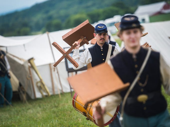 Re-enactors with the 46th Pennsylvania Brass Band carry