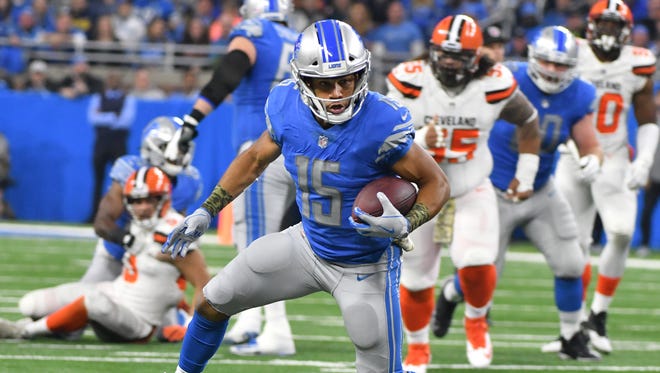 Lions wide receiver Golden Tate works upfield after a reception in the first quarter.