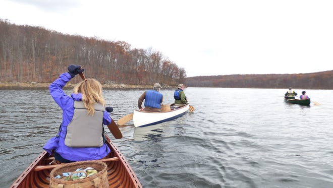 Members of the Delaware Valley chapter of Wooden Canoe Heritage Association embark on their annual paddle on Split Rock Reservoir in Rockaway Township, during which they collected seven bags of trash.