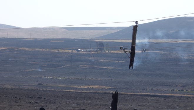 A power line near Midas, Nev., sustained damage from the Hot Pot fire that burned perilously close to the Elko County hamlet. Photo shot Monday, July 4, 2016.