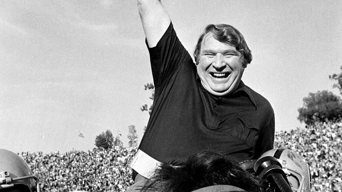 FILE - Coach John Madden of the Oakland Raiders is carried from the field by his players after his team defeated the Minnesota Vikings in Super Bowl XI in Pasadena, Calif., Jan. 9, 1977  John Madden, the Hall of Fame coach turned broadcaster whose exuberant calls combined with simple explanations provided a weekly soundtrack to NFL games for three decades, died Tuesday, Dec. 28, 2021, the NFL said. He was 85. (AP Photo/File)