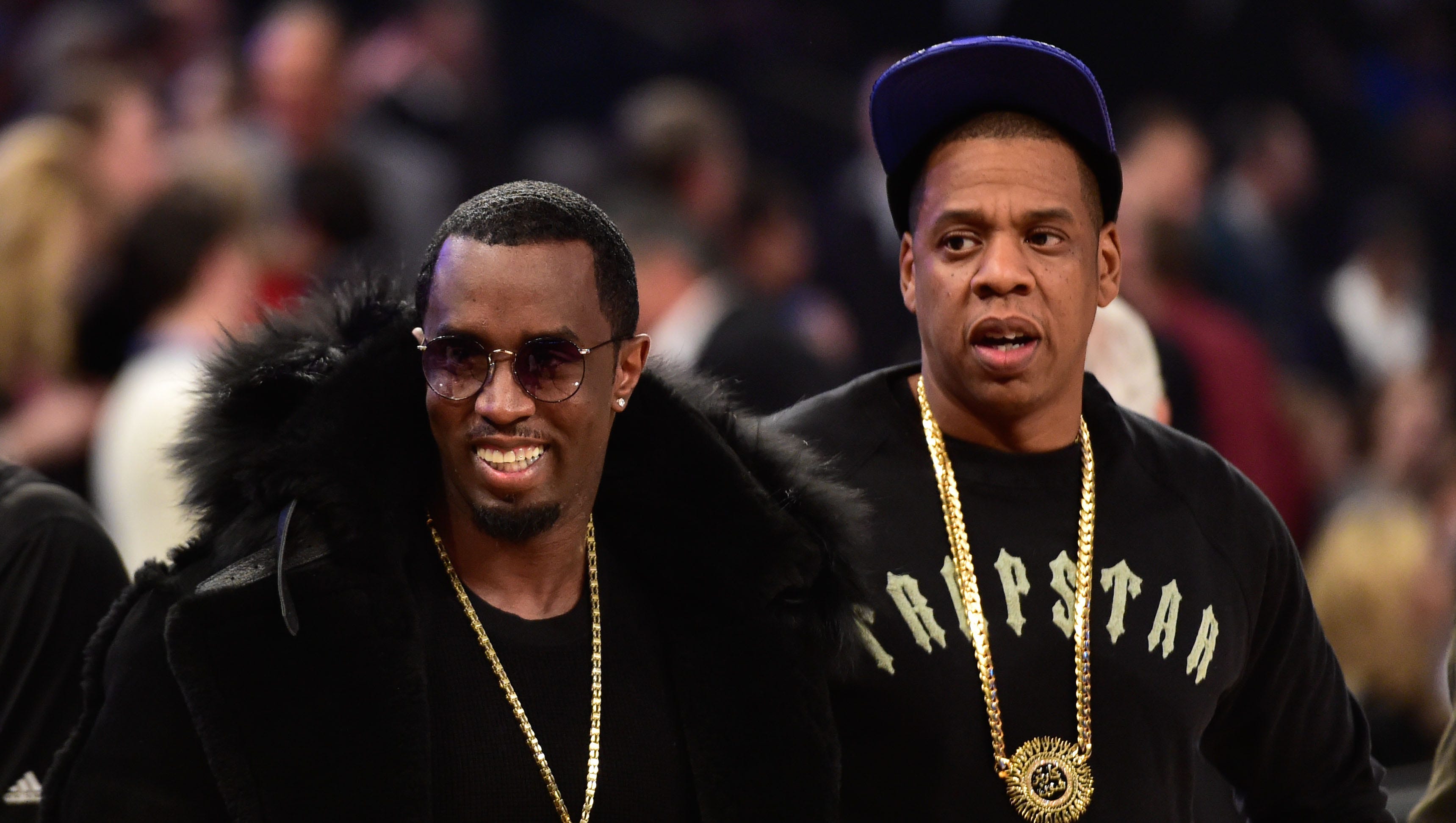 Rap icons Jay-Z and P. Diddy take in the action.